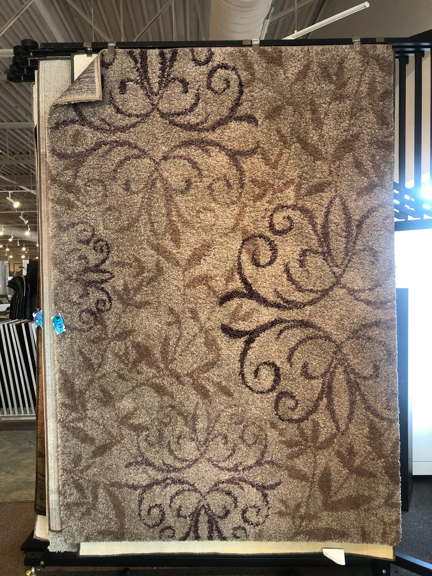 Tan floral pattern area rug