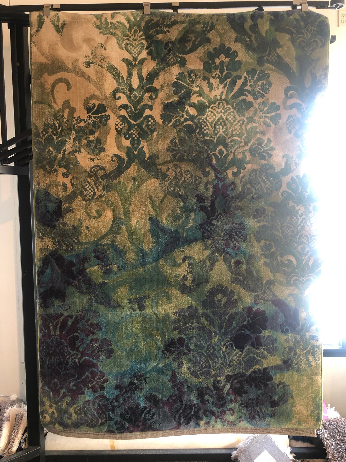 Purple and green pattered area rug