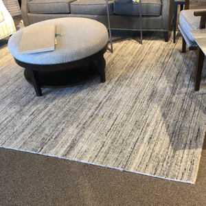 Gray and cream textured area rug
